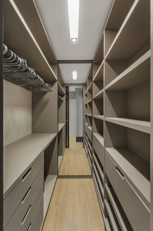 Large walk-in closet designs in Kenya, modern walk-in closets, wooden walk-in closets, sliding door walk-in closets, bedroom closet designs, custom walk-in closets Kenya, walk-in closet installation services, SUIMAS walk-in closets.