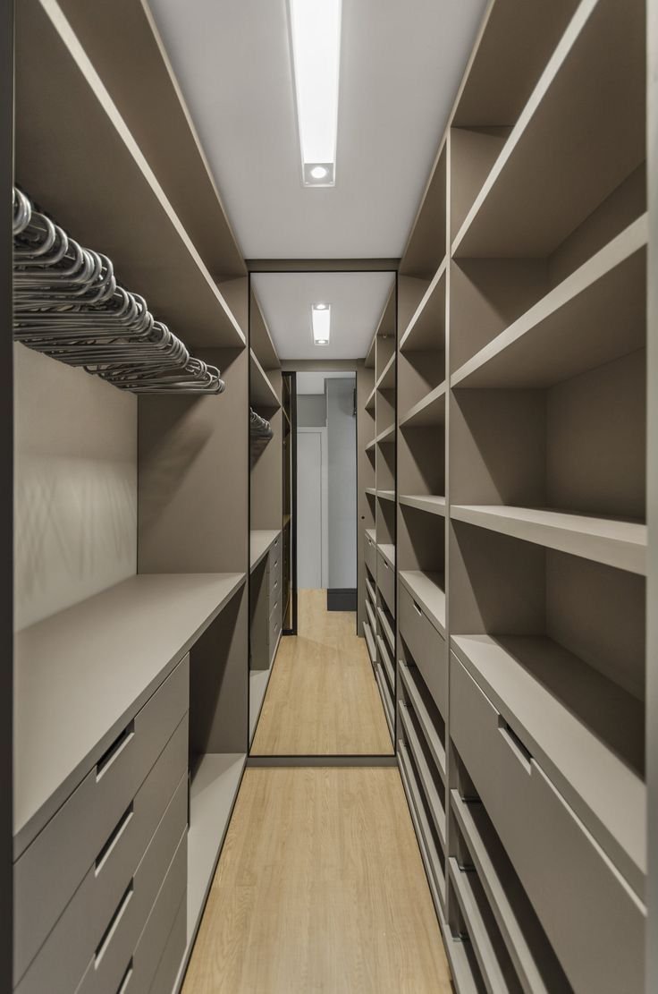 Large walk-in closet designs in Kenya, modern walk-in closets, wooden walk-in closets, sliding door walk-in closets, bedroom closet designs, custom walk-in closets Kenya, walk-in closet installation services, SUIMAS walk-in closets.